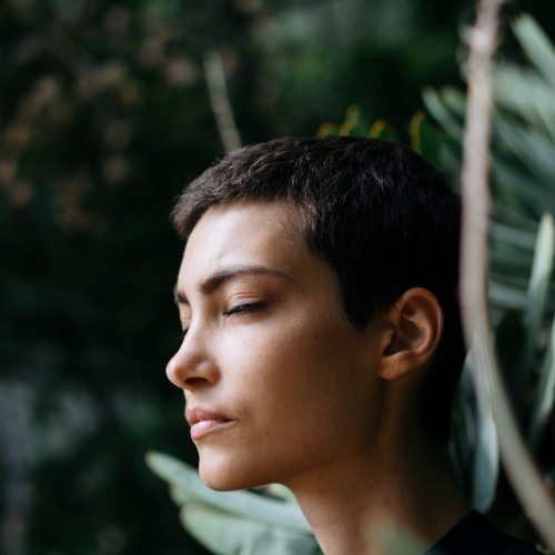 woman surrounded by trees