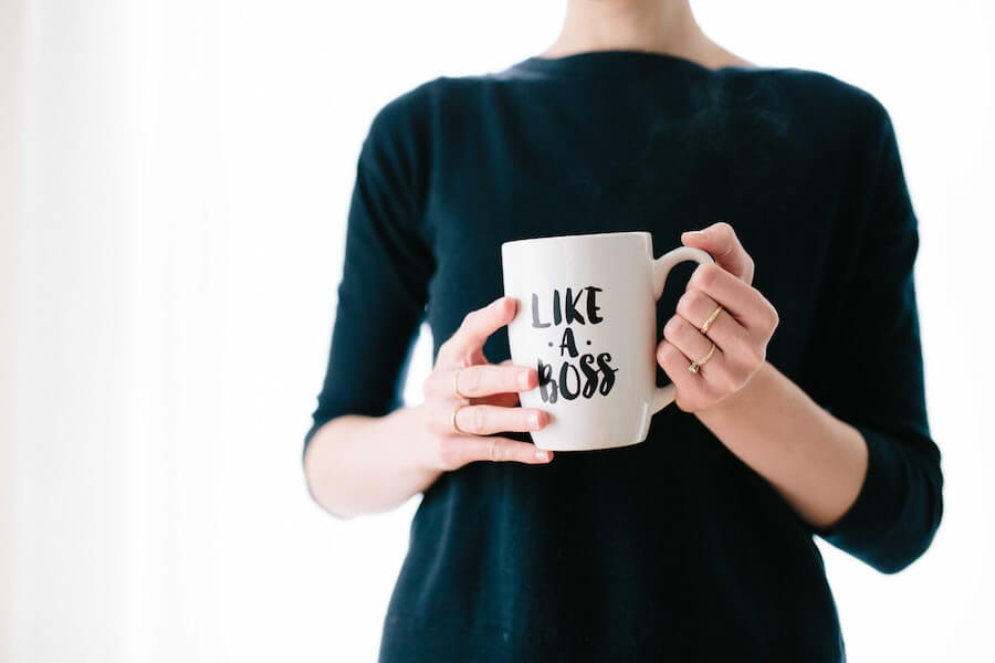 woman holding like a boss cup