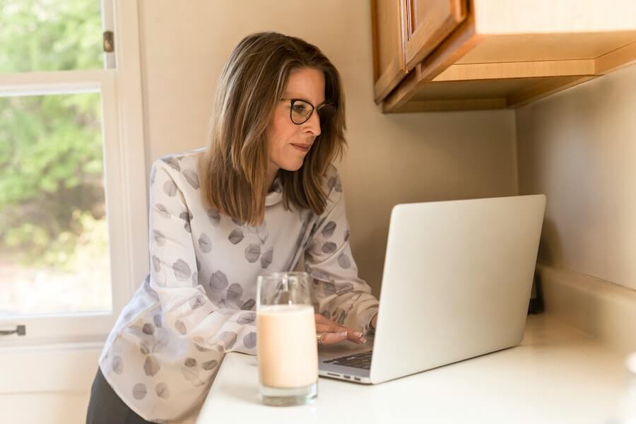 woman looking at laptop